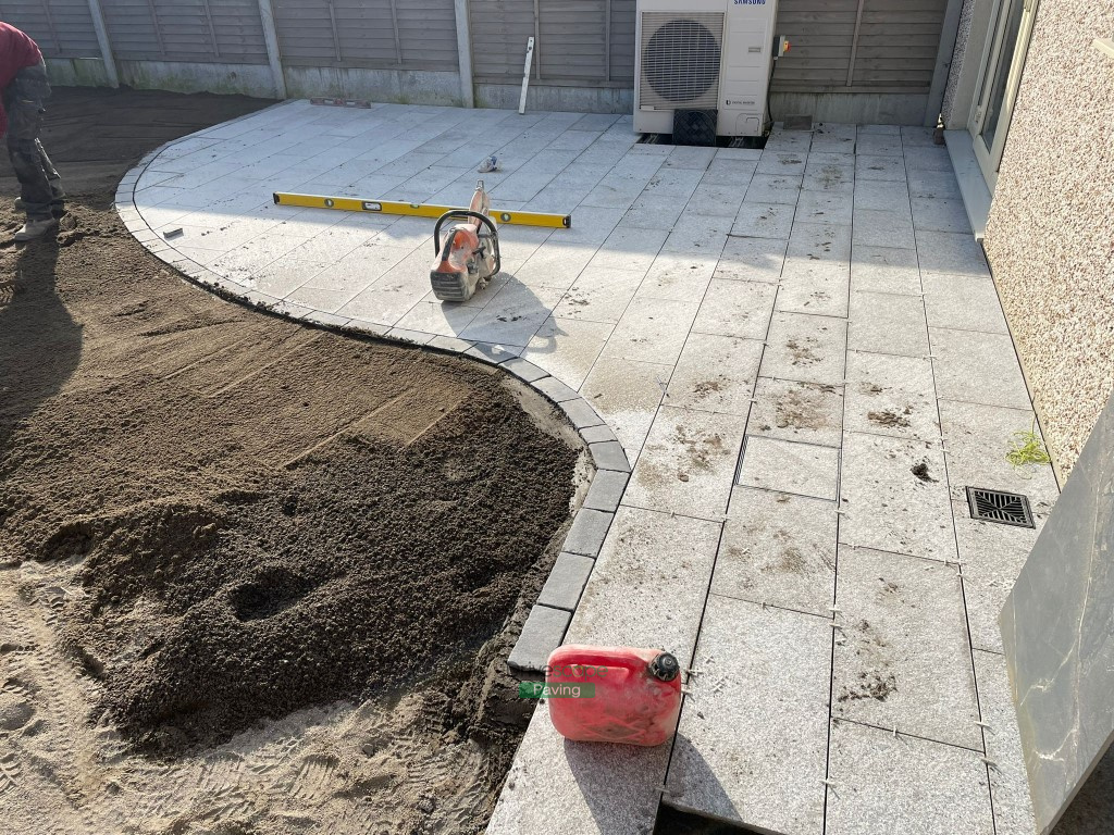 Patio with Granite Slabs, Cobbled Border and Roll-On Turf in Hansfield ...