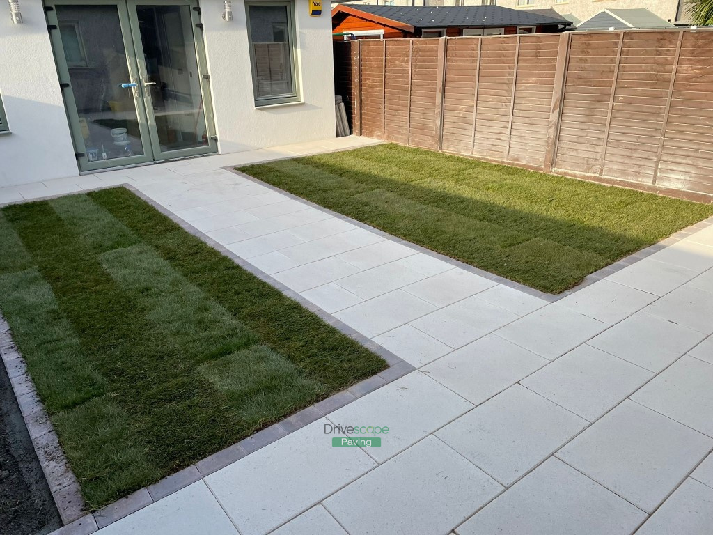 Patio with Quartz Slabs, Rustic Slane Border and Roll-On Turf in ...